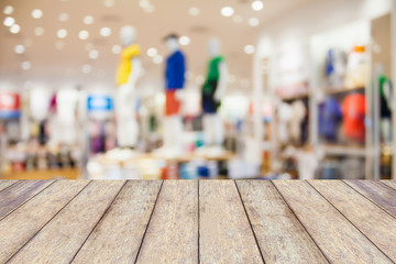 Empty table and blur clothing store with bokeh background