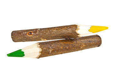 Two bark covered branch colored pencils isolated on white backgr