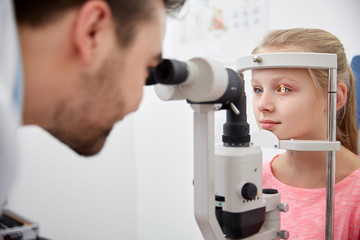 Canvas Print - optician with tonometer and patient at eye clinic