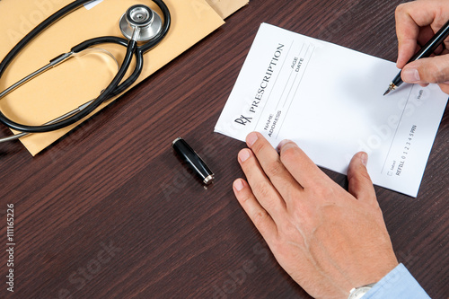 writing prescription doctor writing prescription on the table sample prescription of a doctor