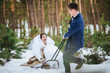 Happy bride and groom in winter wedding day with sleigh