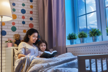 Wall Mural - mother reading a book