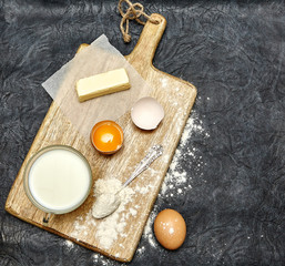 Ingredients for domestick baking. dark background. cooking concept