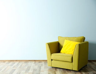 Wall Mural - Green armchair on blue wall background