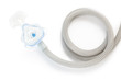 CPAP mask and hose on white background