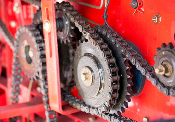 gears and chains on red background