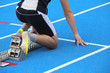 © ChiccoDodiFC - muscular athlete in the starting blocks of a athletic track