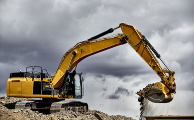 Constuction industry heavy equipment excavator loading gravel