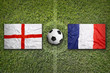 England vs. France flags on soccer field