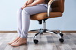 © Africa Studio - Woman sitting on the office chair indoors