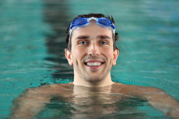 Canvas Print - Head of handsome man in the swimming pool