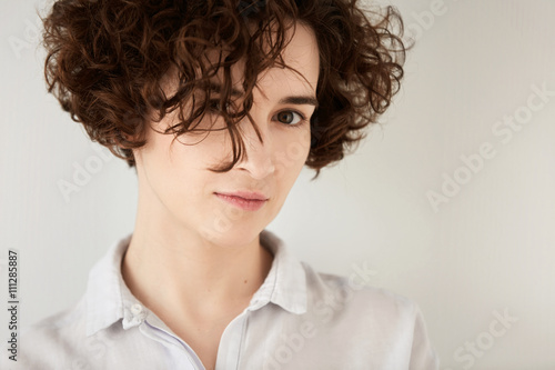 Isolated Headshot Of Beautiful Hipster Girl With Short Curly Hair