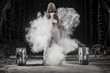 © ADDICTIVE STOCK - Rear view of woman working out with weights in the gym