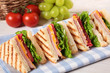Summer picnic club sandwich ham and cheese in a row