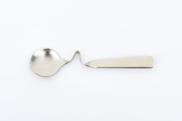 Wall Mural - bent metal spoon