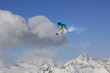© Vasily Merkushev - Snowboard rider jumping on mountains. Extreme snowboard freeride sport.