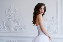 Young Beautiful Bride Standing In Antique Interior Ornamental Design Done With A Moldings. Luxury Interior.