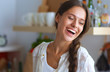 © lenets_tan - Young woman standing near desk in the kitchen