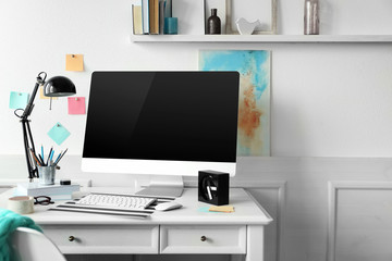 Sticker - Modern wide screen monitor and lamp on white table in room interior