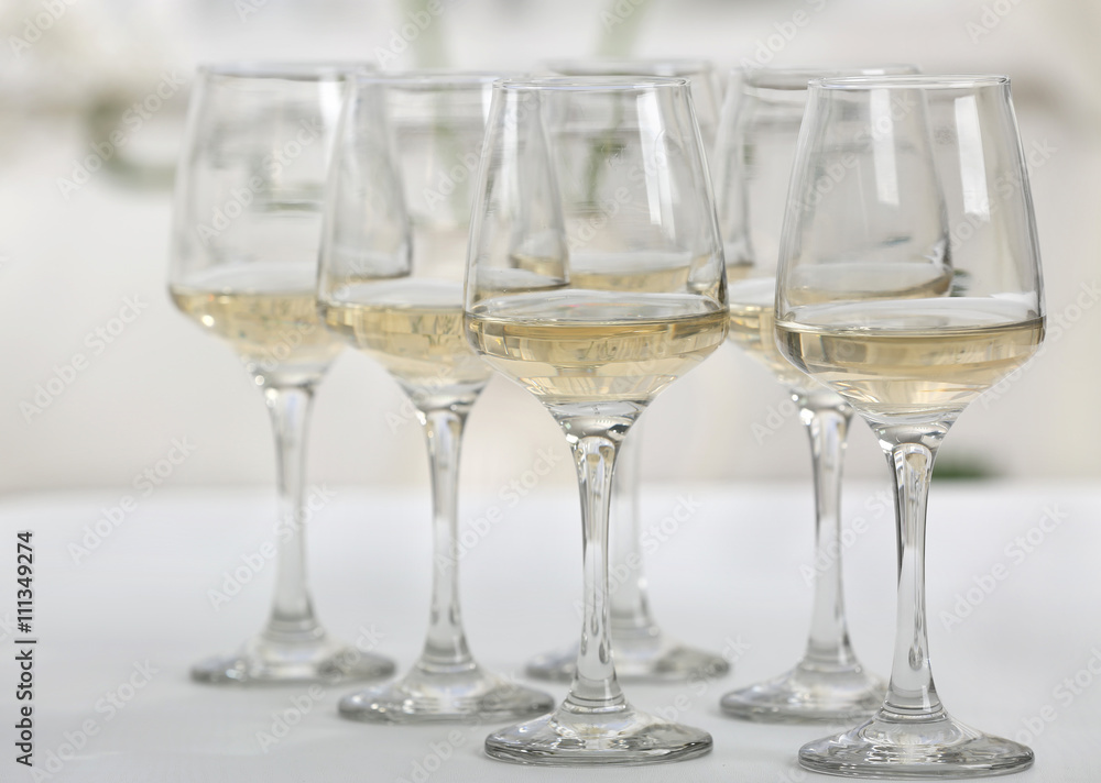 Glasses of white wine on table closeup