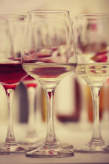 Poster - Wine glasses with red and white wine, closeup