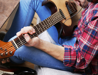 Wall Mural - Man with guitar indoors