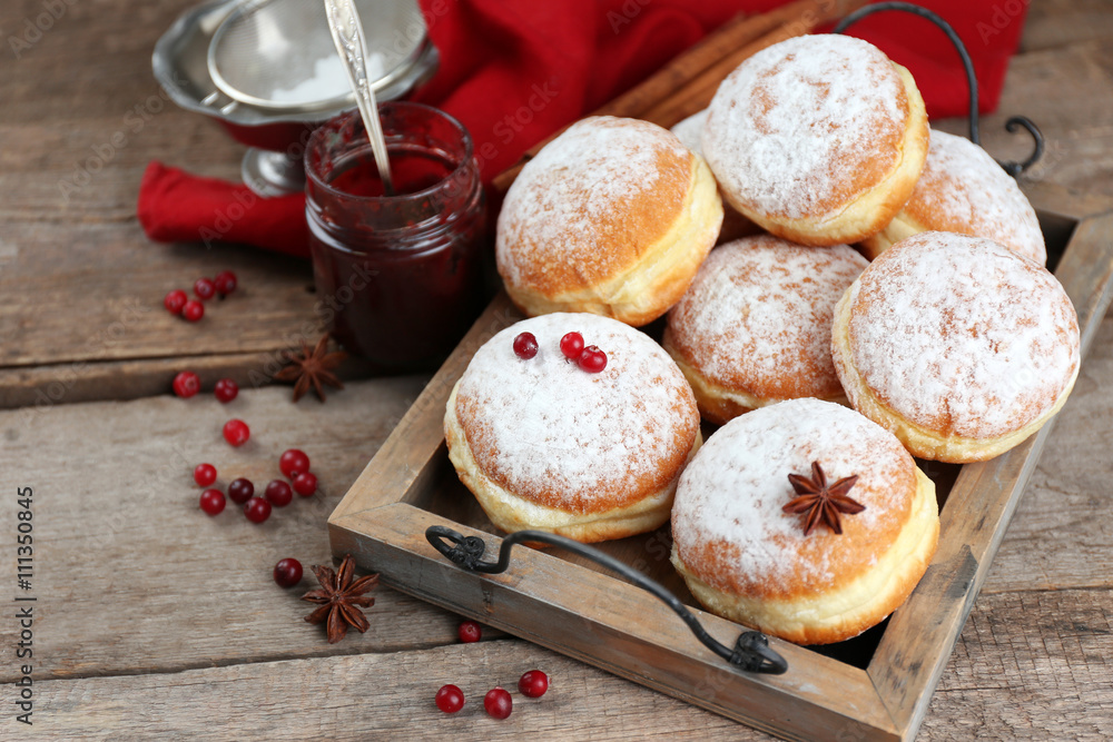 Fresh homemade donuts with powdered sugar, close up