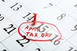 © Africa Studio - April tax day written and pinned in a calender on date of 15th, close up