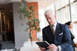 © .shock - senior business man working on tablet computer