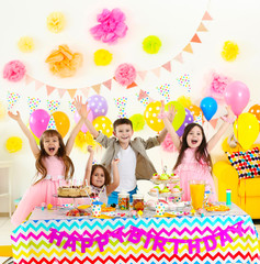 Happy group of children having fun at birthday party