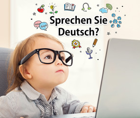 Wall Mural - Sprechen Sie Deutsch (Do you speak German) texts with toddler girl