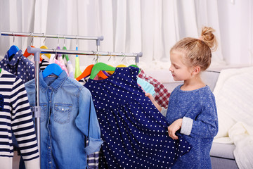 Little girl trying on a new dress