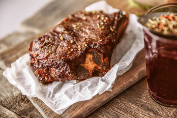 Canvas Print - Roasted pork steak with wineglass  and spices on wooden background