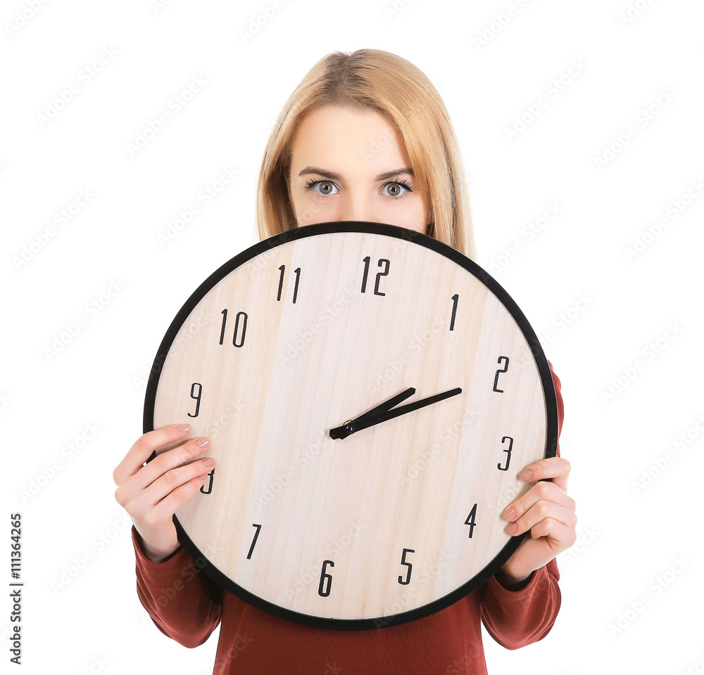 Beautiful young girl holding clock, isolated on white