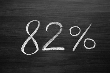 Wall Mural - 82 percent header written with a chalk on the blackboard
