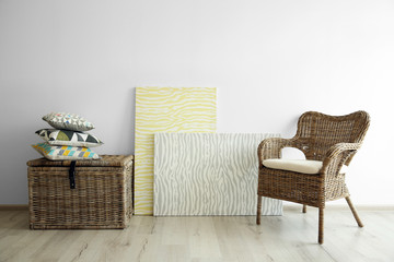 Wall Mural - Wicker furniture on light wall background