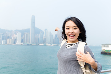 Wall Mural - Excited woman travel in Hong Kong city