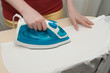 © litts - Young woman ironing clothes, housework