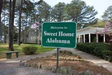 sweet home alabama welcome sign at rest area stop off highway