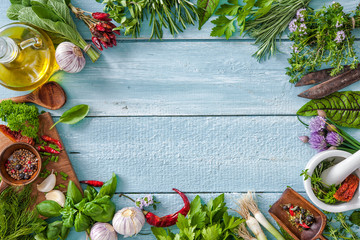 Wall Mural - fresh herbs and spices on wooden table
