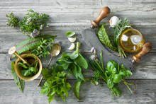 Fresh Herbs And Spices On Wooden Table