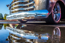  Pick Up Truck And Its Grille Reflecting In Puddle