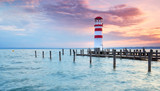 Fototapeta Zachód słońca - Abendstimmung am See, Leuchtturm und Steg