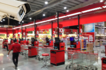 Wall Mural - CCTV Security Camera operating in counter service cashier.