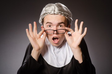 Wall Mural - Funny man wearing nun clothing