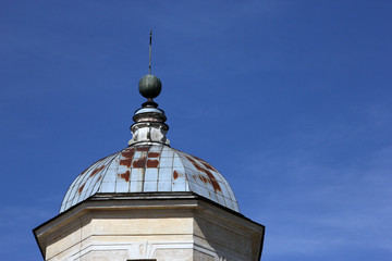 Old rusty metal dome of orthodox church in classic style and blu