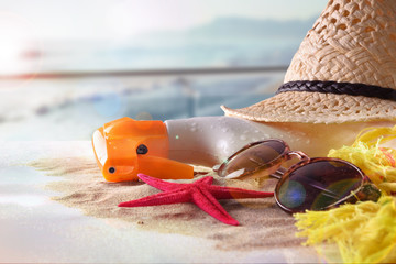 Sun protection articles on table in terrace overlooking beach