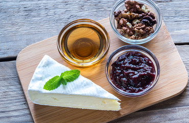 Wall Mural - Brie cheese with honey, jam and nuts