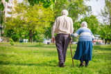 Fototapeta  - Senior couple walking outdoors in spring