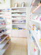 blur shelves filled with medication in the pharmacy